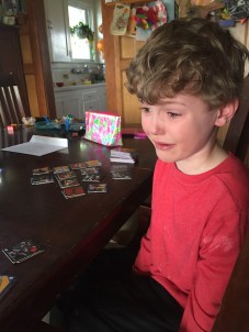 Sad child crying at table