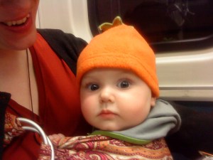 Infant riding in ring sling on board airplane