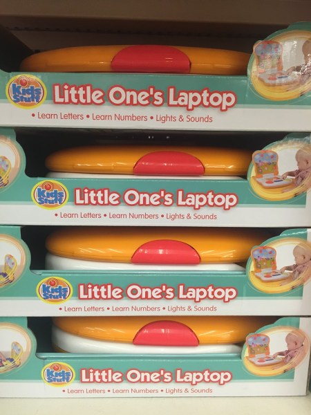 Stack of My first laptop toys on store shelf