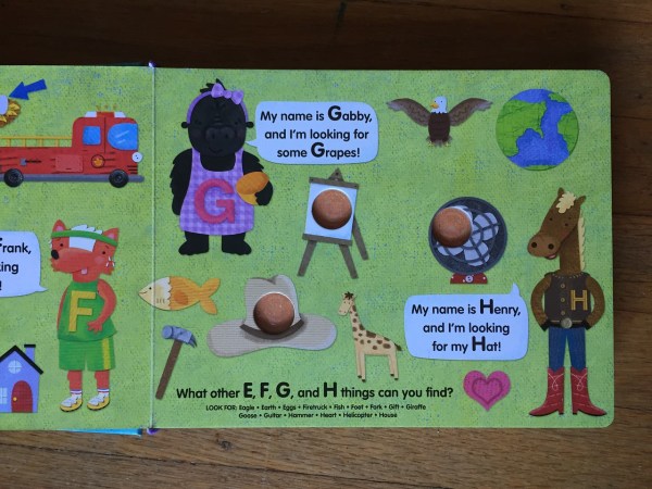 G and H letter page from Poke-a-dot Eye Spy board book by ikids