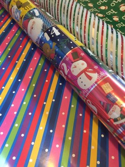 Costco rolls of reversible Christmas and all occasion wrapping paper