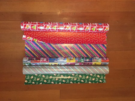 Costco three giant rolls of reversible wrapping paper on rolls