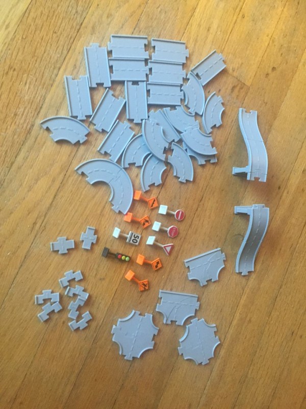 Pieces from Driven pocket series toy construction bridges and trucks play set with connecting road pieces road signs and tiny vehicles