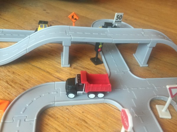 Driven Pocket Series trucks vehicles toy Construction bridges set assembled on wood floor