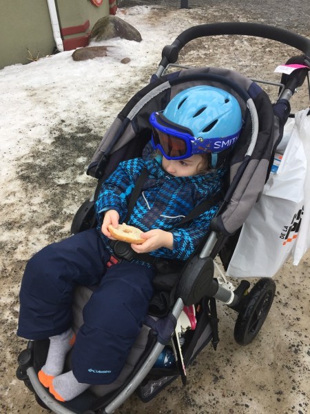 Preschooler wearing Columbia Frosty Slopes snow clothes set while riding in BOB Motion stroller