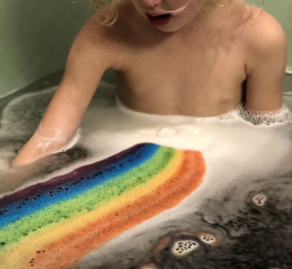 Bella Grace Bath Rainbow Bath Fizzy releasing color in tub