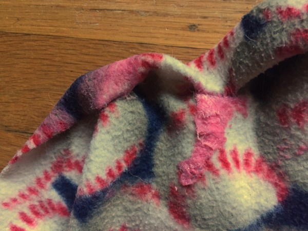 Pink scented silly putty on baseball fleece blanket