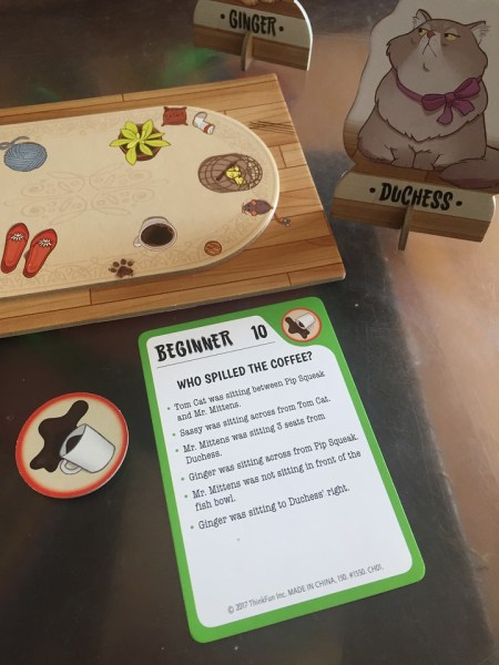 Cat Crimes card challange next to board crime token and cat piece