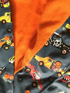 Hatley Raincoat snap with monster truck print and