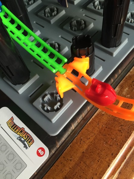 Roller Coaster Challenge logic puzzle STEM game with coaster at end of track and game card showing