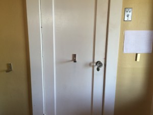 Three IKEA Bjarnum folding wall hooks installed on door and walls