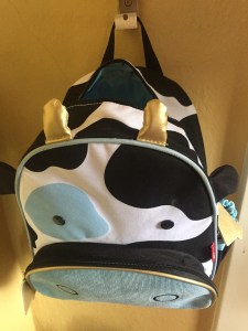 Skip Hop Zoo little kids backpack hanging on IKEA Bjarnum folding hook mounted on wall