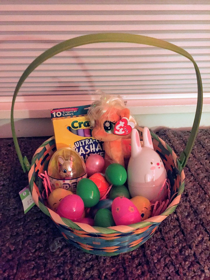 Easter basket filled with eggs and small gifts