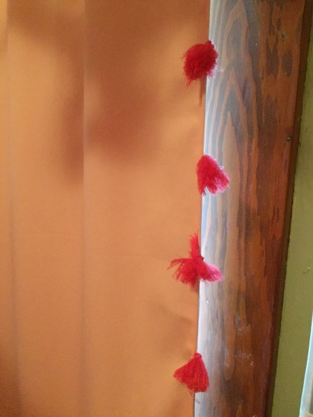 Pillowfort kids pink blackout curtain with hot pink tassels blocking light