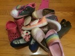 Pile of kid shoes on the floor