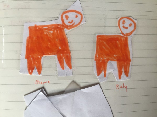 Child's drawing of mama and baby orange pigs