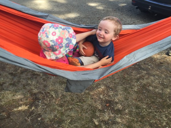Eagles Nest Outfitters orange hammock with toddler and preschooler sitting inside