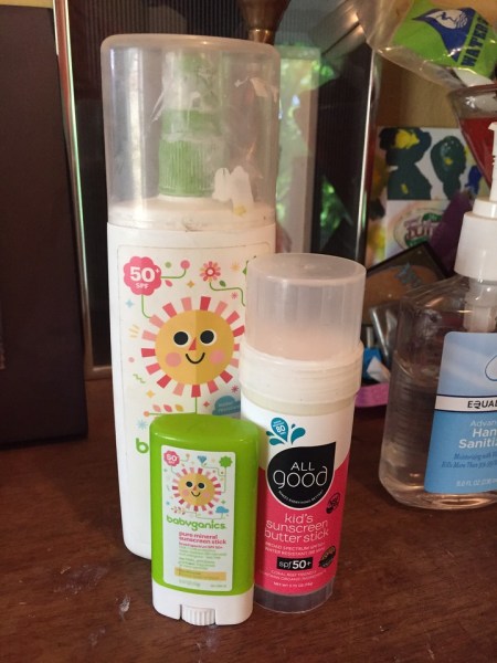 Sunscreen on shelf Babyganics SPF 50 stick, spray lotion, and All Good kids sunscreen butter stick