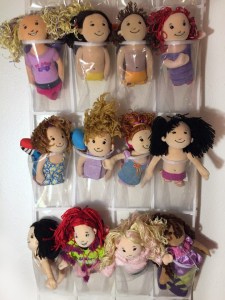 Manhattan Toy Company Groovy Girls stored in hanging shoe organizer pockets