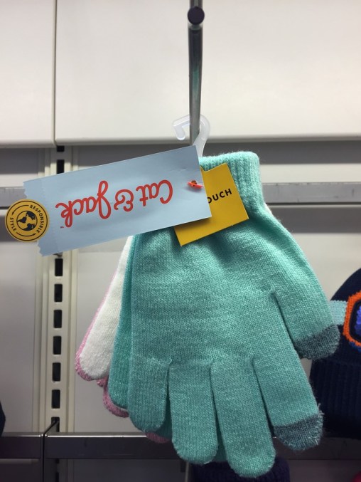 Cat & Jack kids one size knit gloves hanging at Target in teal, white, and pale pink with touchscreen fingertips
