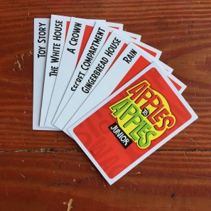 Red apple cards from Apples to Apples Junior card game fanned out