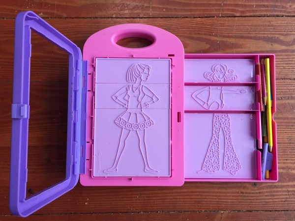 Melissa and Doug Fashion Design Studio Rubbing Plate Art Kit pink case with purple paper holder shown open