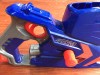 Nerf Nitro Car Blaster launcher close up view of trigger blue orange and gray plastic