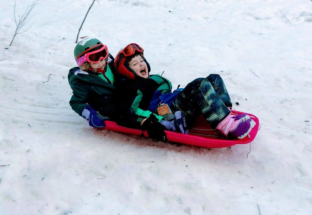 Kids wearing Champion snow clothes bib jacket pants from Target sledding