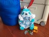 Creativity for Kids Weighted Sequined Pet Sloth blue wearing doll dress, REI Kids Nodder Sleeping bag, Driven Pocket Series garage and tiny truck with connecting road pieces, and JetKids BedBox