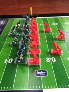 Two teams lined up on the 20 yard line in NFL Electric Football game