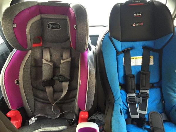 Evenflo Evolve 3 in 1 booster car seat next to Britax Marathon convertible car seat in back third row of Mazda5