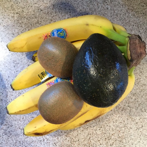 Bananas, avocados, and kiwis on counter