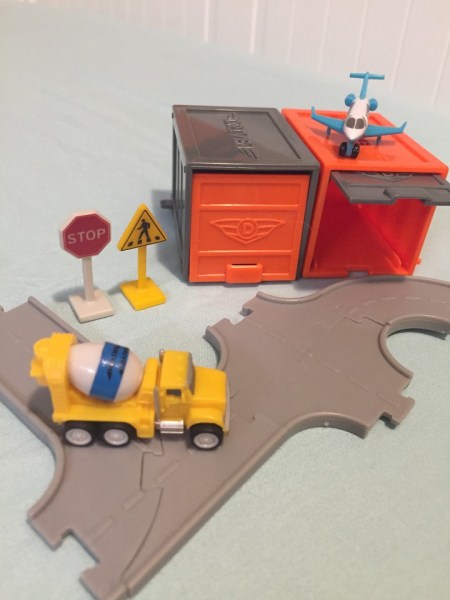 Driven Pocket Series 2 tiny trucks vehicles with garage in gray and orange and six connected road pieces