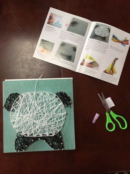 Craft-tastic String art kit for kids pandacorn edition in progress shown partly completed with scissors and instructions