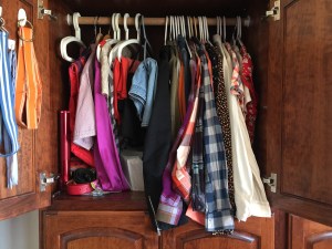 Wardrobe closet hanging space overflowing with clothes hanging too low long