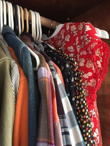 Clothes using Higher Hangers hung next to regular plastic hangers on same closet rod