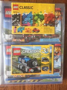 Lego Classic instruction manuals inside photo page protectors of three ring binders