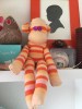 Finnoola Peach Sock monkey animal craft project finished sitting on shelf