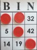 Bingo paper card with Connect4 chips marking numbers