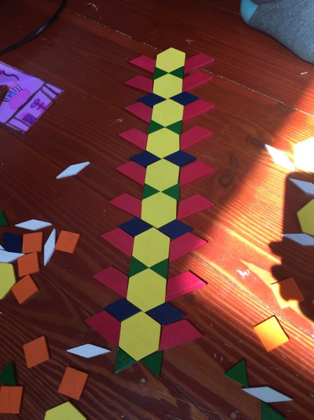 Melissa & Doug pattern blocks laid out on floor