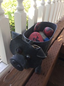 Metal pig decorative pot plant stand filled with rocks