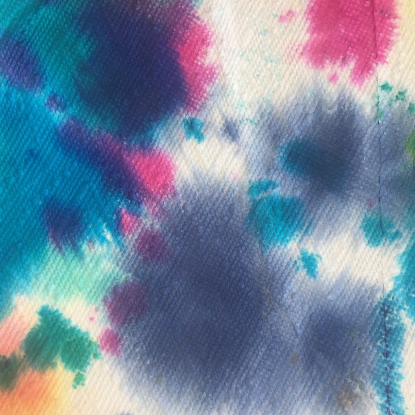 Present wrapped in tie dyed paper towels