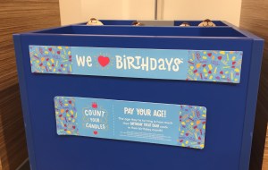 Build-A-Bear Count your candles pay your age box in store signs