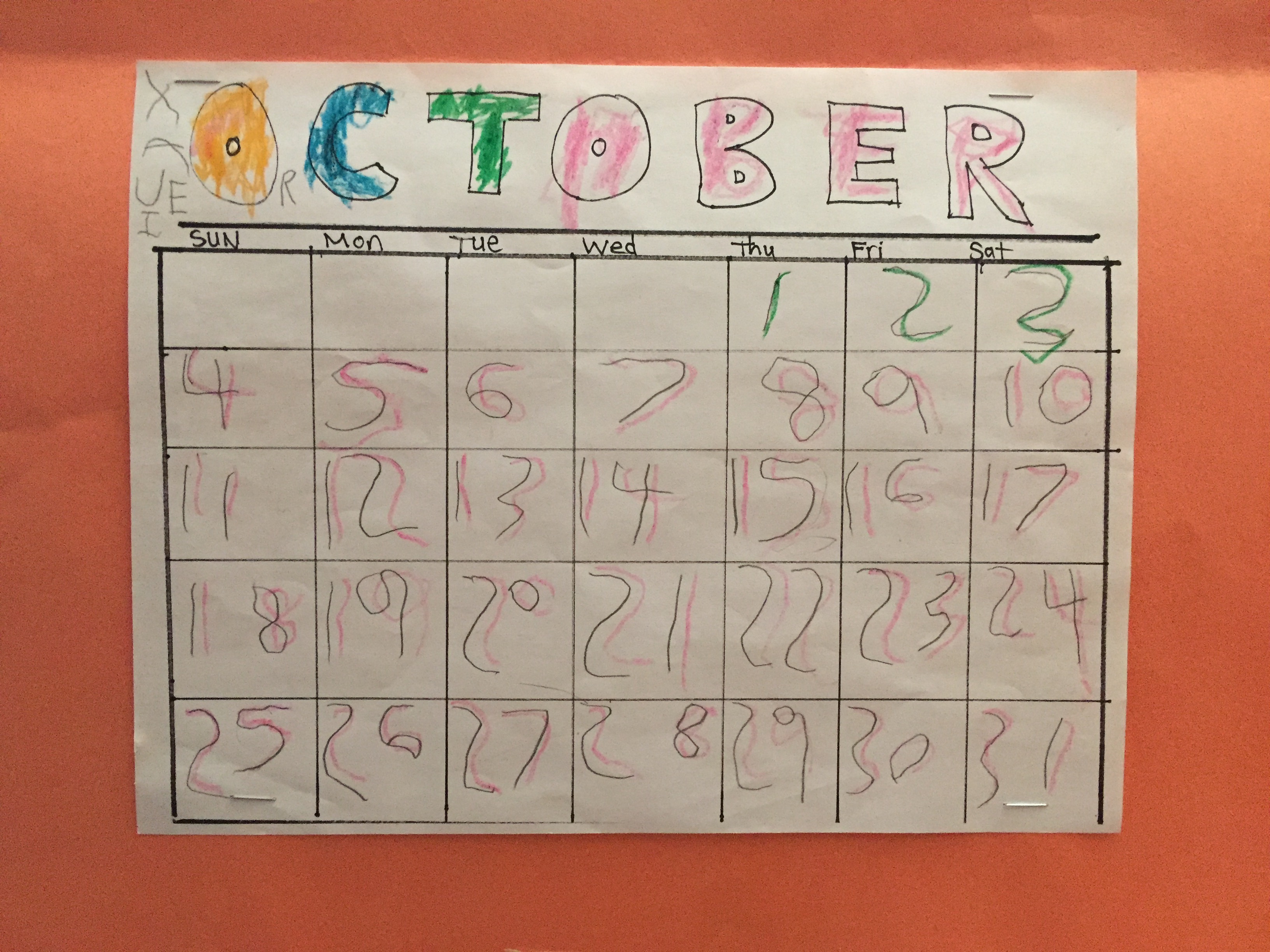 October handmade calendar by five year old child with handwritten numbers