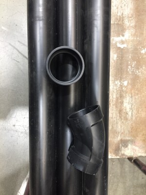 Black pipe, connector, and 45 degree curve at home improvement store