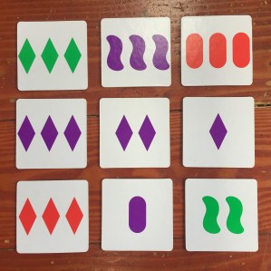 Set Junior tiles laid out on wooden floor