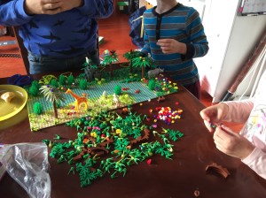 Three kids playing with Jungle Forest Garden Park brick building set offbrand Lego by Yamix