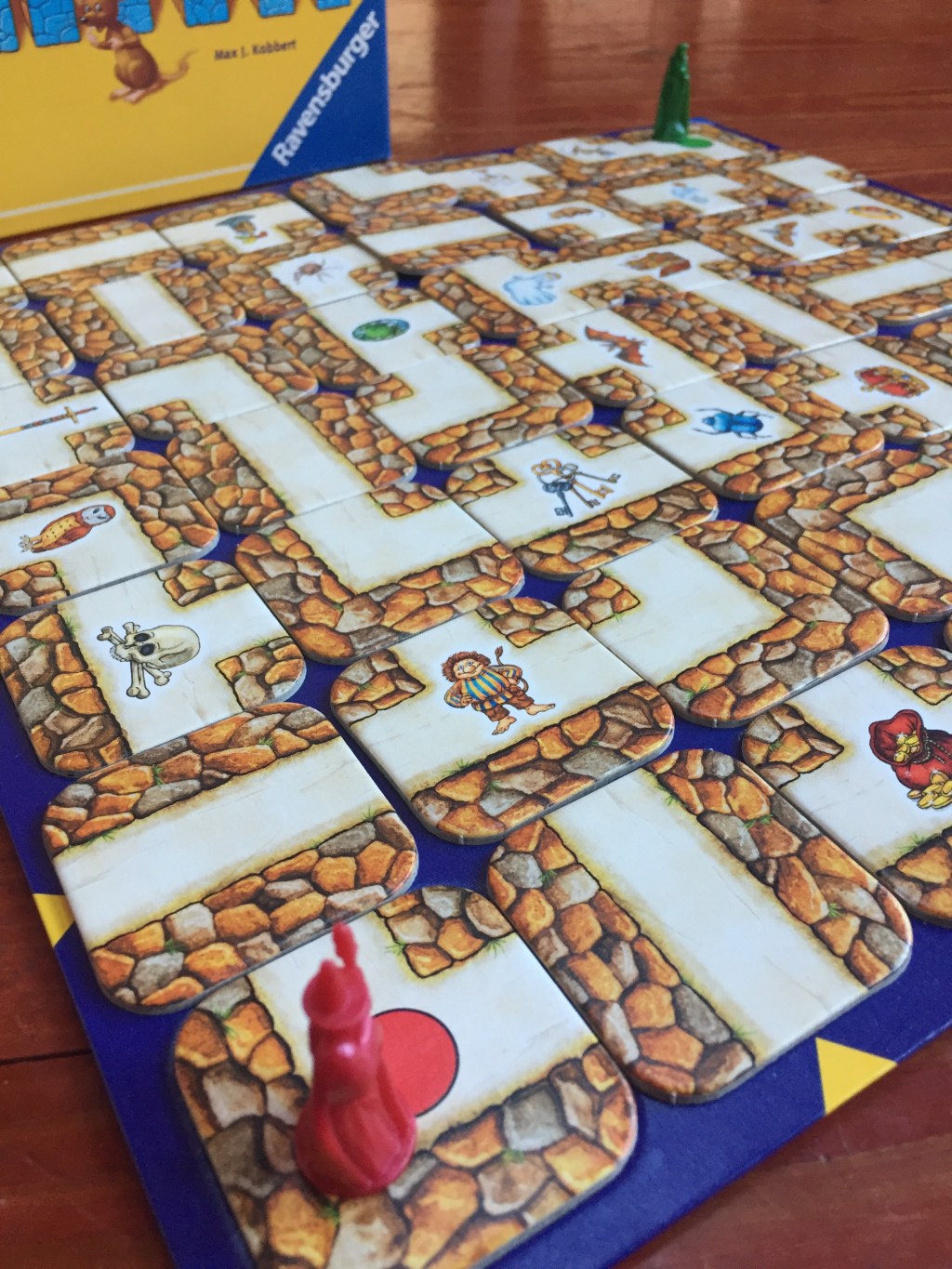 Red wizard figure on corner of Labyrinth game for kids moving maze from Ravensburger