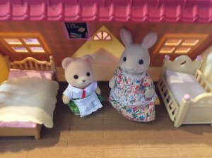 Calico Critters hopscotch rabbit and school lunch bear on second floor of cozy cottage