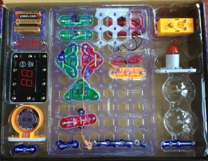 Snap Circuits Arcade pieces in clear plastic organizer inside box